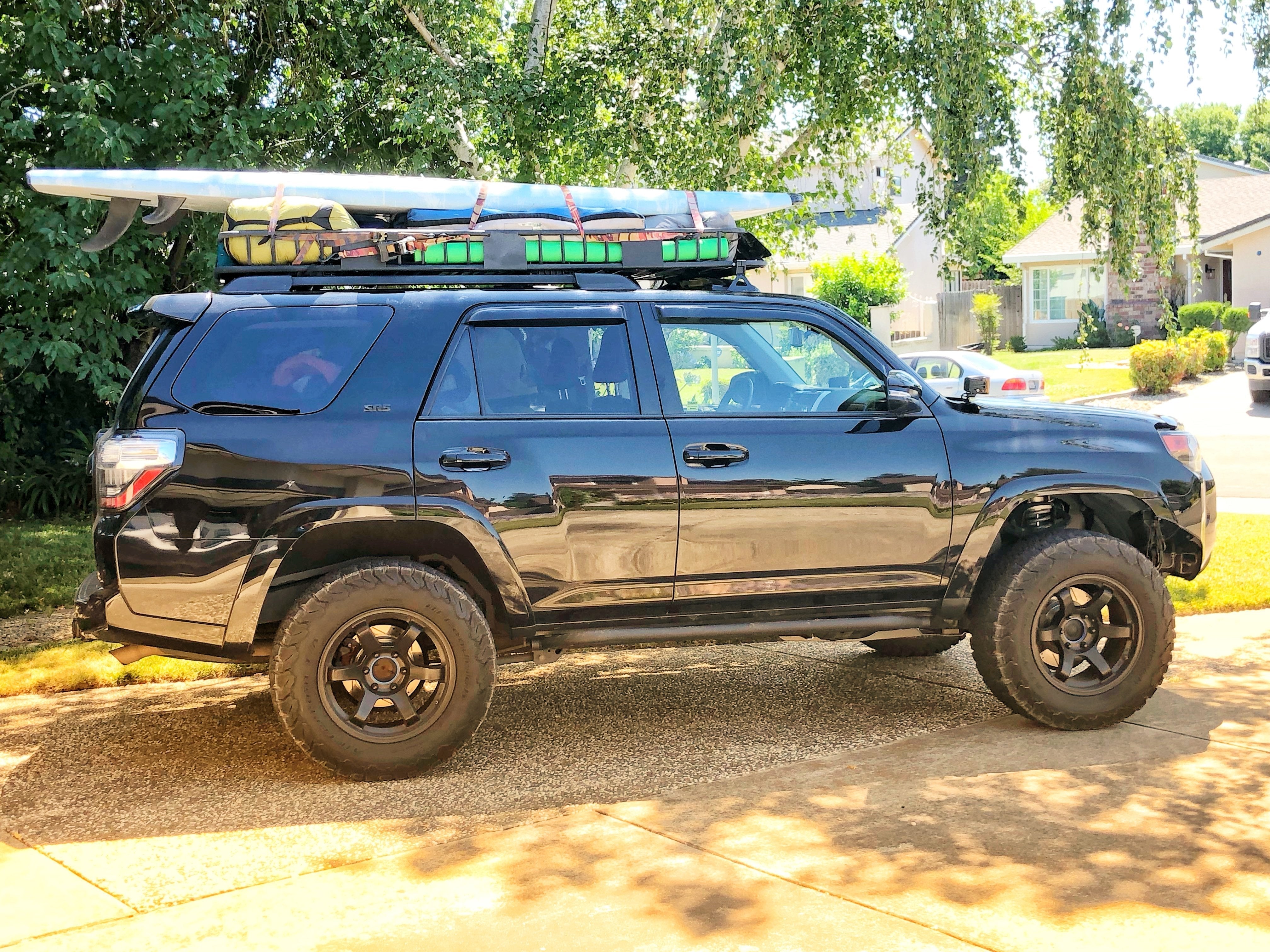 Passenger side - Trail Edition Bolt On Rock Sliders installed on black 4Runner - Cali Raised LED