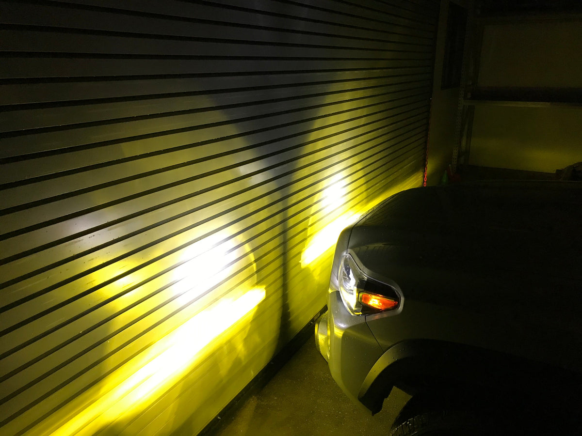 Tri-Color Fog Light Replacement Bulbs shining Amber light - Cali Raised LED