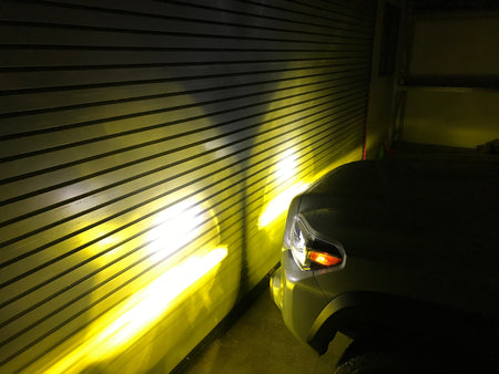 Tri-Color Fog Light Replacement Bulbs shining Amber light - Cali Raised LED